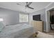 Cozy bedroom with a ceiling fan, large window for natural light, and spacious closet at 3736 Melrose Cottage Dr, Matthews, NC 28105