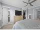 Bright bedroom with a ceiling fan, natural light, and convenient access to bathroom and closet at 3736 Melrose Cottage Dr, Matthews, NC 28105