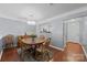 Cozy dining area with classic wooden furniture, stylish rug and a modern light fixture at 3736 Melrose Cottage Dr, Matthews, NC 28105