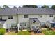 Aerial view of home exterior showcasing the patio, siding, and well-maintained lawn at 3736 Melrose Cottage Dr, Matthews, NC 28105