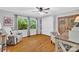 Bedroom features neutral walls, hardwood floors, an accent chair and an abundance of natural light at 3810 Springway Dr, Gastonia, NC 28056