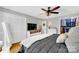 Bright bedroom with closet, dresser, and mounted TV for a relaxing retreat at 3810 Springway Dr, Gastonia, NC 28056