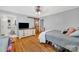 Bedroom with hardwood floors, ensuite bathroom, and a wooden sliding barn door at 3810 Springway Dr, Gastonia, NC 28056