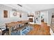 Charming dining room boasts a rustic wooden table, brick fireplace, and hardwood floors at 3810 Springway Dr, Gastonia, NC 28056