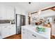 Kitchen featuring white cabinets, stainless steel appliances, a marble island, and hardwood floors at 3810 Springway Dr, Gastonia, NC 28056