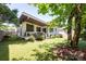 Enjoy a well-manicured backyard with a patio, lush lawn, and beautiful landscaping at 4211 Mantle Ct, Charlotte, NC 28205