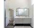 Modern bathroom featuring a double vanity, hexagonal floors, and glass shower at 4211 Mantle Ct, Charlotte, NC 28205