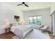 Bright bedroom with neutral colors, lots of natural light, a ceiling fan, and hardwood floors at 4211 Mantle Ct, Charlotte, NC 28205