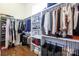 Organized walk-in closet with shelving, hanging rods, and storage solutions for clothing and accessories at 4211 Mantle Ct, Charlotte, NC 28205