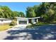 Charming single-story home with a modern design, well-manicured lawn, and inviting curb appeal at 4211 Mantle Ct, Charlotte, NC 28205