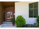 Charming entrance with a red door, decorative wreath, and modern lighting fixtures at 4211 Mantle Ct, Charlotte, NC 28205