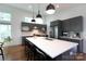Spacious kitchen featuring a large island, modern appliances, and sleek gray cabinets at 4211 Mantle Ct, Charlotte, NC 28205