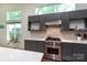 Well-equipped kitchen boasts stainless steel appliances, gas range, and stylish backsplash at 4211 Mantle Ct, Charlotte, NC 28205