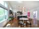 Bright eat-in kitchen with modern lighting, countertops, stainless appliances, and a large pantry at 4211 Mantle Ct, Charlotte, NC 28205