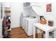 Efficient laundry room equipped with modern washer and dryer, shelving, and folding area at 4211 Mantle Ct, Charlotte, NC 28205