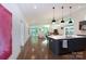 Open living space with hardwood floors, modern lighting, and a seamless flow at 4211 Mantle Ct, Charlotte, NC 28205