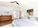 Spacious main bedroom with a wood dresser, en suite bathroom, hardwood floors, and bright white walls at 4211 Mantle Ct, Charlotte, NC 28205