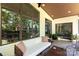 Cozy screened porch with comfortable seating and an outdoor living area at 4211 Mantle Ct, Charlotte, NC 28205