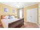 Cozy bedroom with a ceiling fan and ample natural light, providing a relaxing and comfortable space at 44449 Oriole Dr # 101, Indian Land, SC 29707