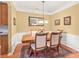 Formal dining room with classic wood table, decorative rug, and elegant wainscoting at 44449 Oriole Dr # 101, Indian Land, SC 29707
