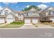 Charming townhomes with brick accents, attached garages, and well-maintained landscaping at 44449 Oriole Dr # 101, Indian Land, SC 29707