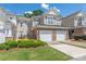 Charming townhome featuring a well-manicured front yard and a convenient two-car attached garage at 44449 Oriole Dr # 101, Indian Land, SC 29707