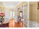 Beautiful foyer with hardwood floors, decorative trim, and an open view into other living spaces at 44449 Oriole Dr # 101, Indian Land, SC 29707