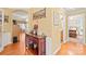 Hallway featuring wood floors and classic trim, connecting living spaces with style and functionality at 44449 Oriole Dr # 101, Indian Land, SC 29707
