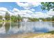 Picturesque pond with fountains and lush greenery, enhancing the community's natural beauty and appeal at 44449 Oriole Dr # 101, Indian Land, SC 29707