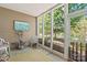 Relaxing screened porch with lake view, providing a serene escape with natural light and privacy at 44449 Oriole Dr # 101, Indian Land, SC 29707