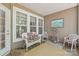 Inviting screened porch with comfortable seating, perfect for relaxing and enjoying the outdoors at 44449 Oriole Dr # 101, Indian Land, SC 29707