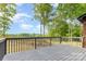 Home's gray back deck overlooking the spacious backyard at 4907 Ardenwoods Dr, Charlotte, NC 28215