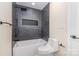 Modern bathroom featuring sleek black tile shower and integrated tub at 4907 Ardenwoods Dr, Charlotte, NC 28215