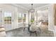 Bright breakfast nook with views, modern light fixture, and seating for four at 4907 Ardenwoods Dr, Charlotte, NC 28215