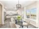 Bright breakfast nook with views, modern light fixture, and seating for four at 4907 Ardenwoods Dr, Charlotte, NC 28215