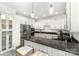 Modern kitchen with stainless steel appliances, granite countertops, and breakfast bar at 4907 Ardenwoods Dr, Charlotte, NC 28215