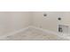 Bright laundry area featuring attractive tile floor and hookups for washer and dryer at 4907 Ardenwoods Dr, Charlotte, NC 28215