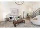 Inviting living room with high ceilings, modern chandelier, and stylish decor at 4907 Ardenwoods Dr, Charlotte, NC 28215