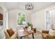 Bright home office with arched windows, hardwood floors, a modern light fixture and stylish decor at 4907 Ardenwoods Dr, Charlotte, NC 28215