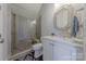 Bathroom featuring a glass shower enclosure, vanity with sink, and tile flooring at 5250 Meadowcroft Way, Fort Mill, SC 29708