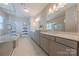 Bright bathroom featuring double vanity, quartz countertop, tile flooring, soaking tub and walk-in glass shower at 5250 Meadowcroft Way, Fort Mill, SC 29708