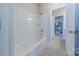 Clean, well-lit bathroom featuring white fixtures, tile flooring, and a shower-tub combo at 5250 Meadowcroft Way, Fort Mill, SC 29708