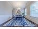 Elegant dining room with modern decor, natural light and hardwood floors at 5250 Meadowcroft Way, Fort Mill, SC 29708