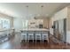 Bright kitchen features a large island with seating, stainless steel appliances, and a breakfast nook at 5250 Meadowcroft Way, Fort Mill, SC 29708