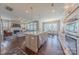 Spacious kitchen featuring a center island, stainless steel dishwasher, and open view to the living and dining areas at 5250 Meadowcroft Way, Fort Mill, SC 29708
