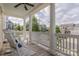 Charming front porch showcasing rocking chairs and neighborhood views on a sunny day at 5250 Meadowcroft Way, Fort Mill, SC 29708