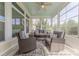 Inviting sunroom with large windows, comfortable seating, and a ceiling fan at 5250 Meadowcroft Way, Fort Mill, SC 29708