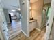 Modern bathroom with updated vanity, granite countertop and a glass-enclosed shower that connects to other living areas at 601 Scottsbrook Dr, Charlotte, NC 28213
