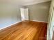 Bedroom with light-gray walls and hardwood floors, providing a warm and inviting atmosphere at 601 Scottsbrook Dr, Charlotte, NC 28213