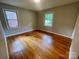 Sunlit bedroom with hardwood floors and a view of the outdoors at 601 Scottsbrook Dr, Charlotte, NC 28213